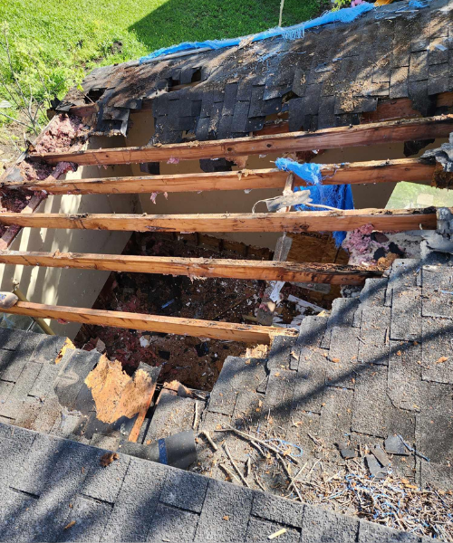 A pile of wood sitting on top of a sidewalk