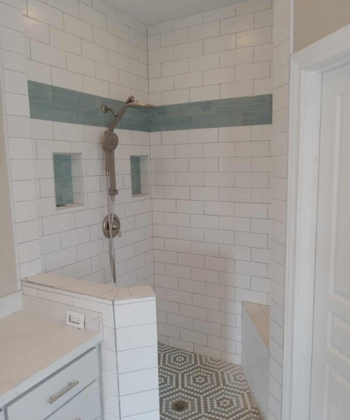 A bathroom with a tiled floor and white walls