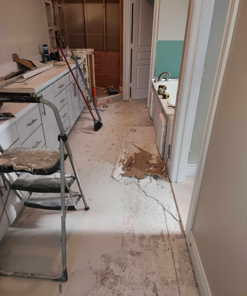 A kitchen that is being remodeled with a ladder